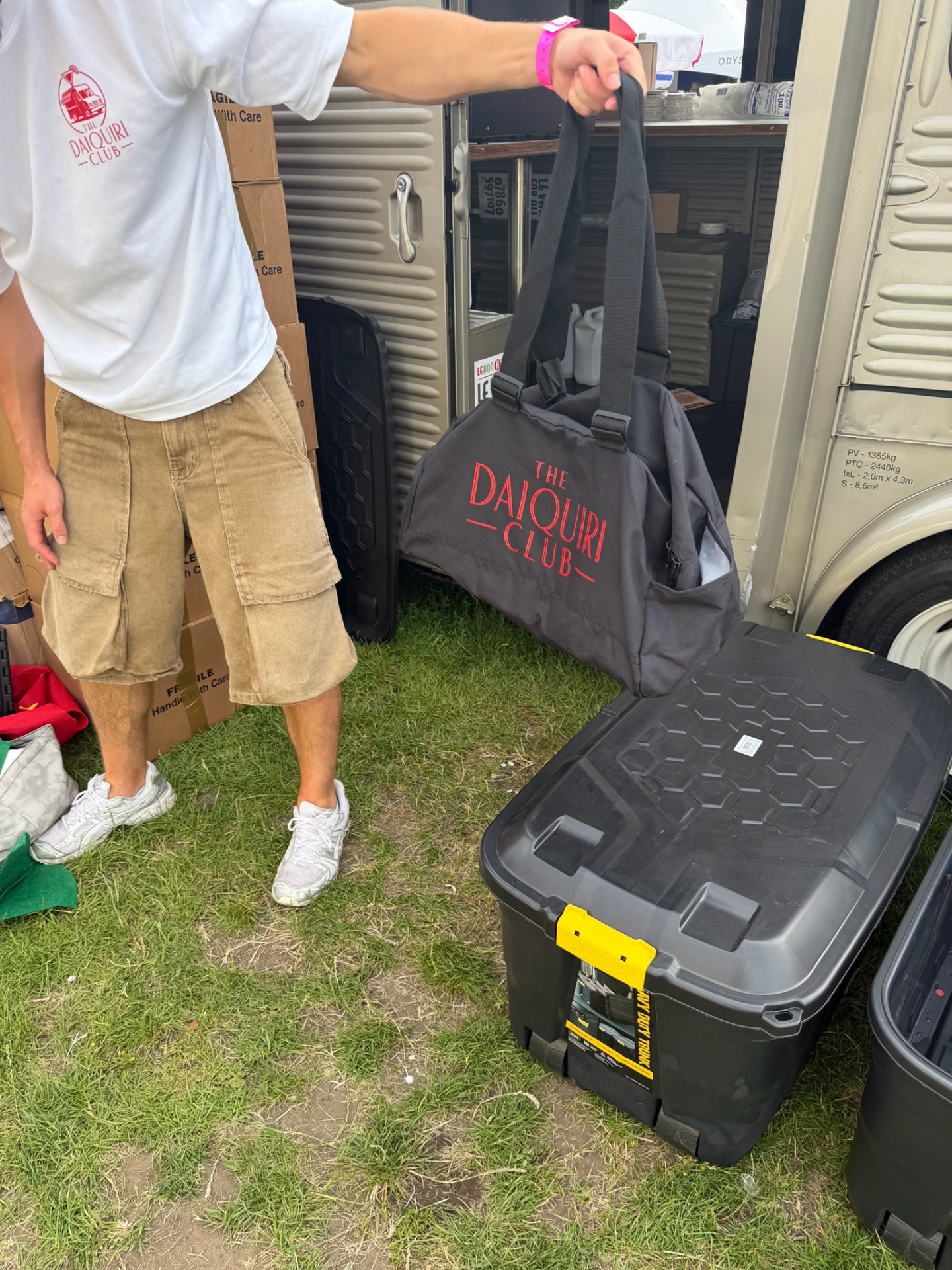 Branded Daiquiri Club tote bag beside the van